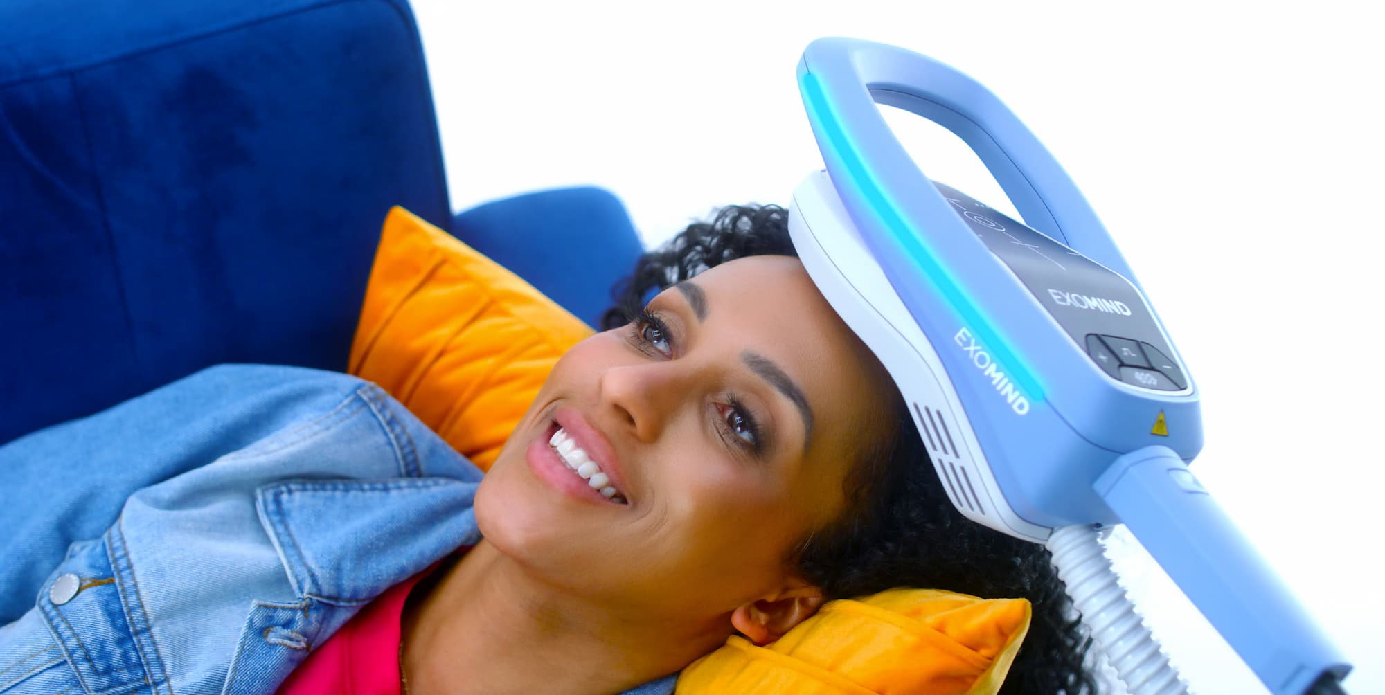 Patient with Exomind applicator resting comfortably on her head while she rests. This is part of a therapy for anxiety in Abilene.